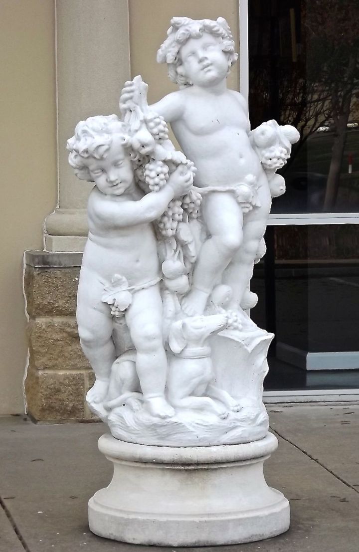 OK...I have no recall on my art history courses from college just who these cherub guys are, but they're between David and Hercules....