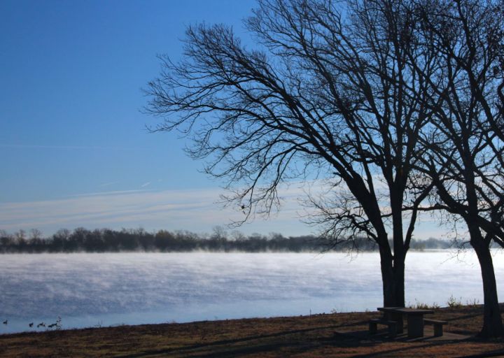 A bit late for the sunrise, but the fog was still lifting off the lake surface