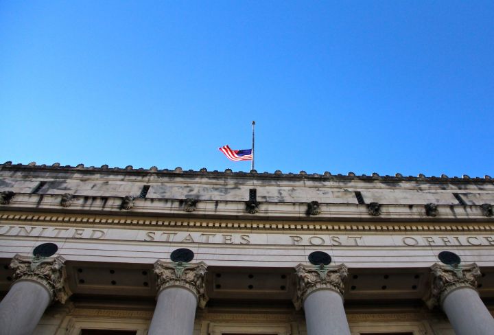 The iconic 79-year old Fort Worth Post Office is located on the south edge of downtown. The flag is a half-staff because of the Newtown school shooting tragedy.