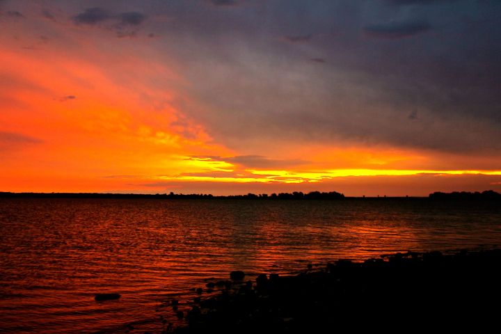 A Thursday morning storm front moved in a few weeks ago. I hustled down to Westlake Park to face a sunrise in the east and lightning over my shoulder....