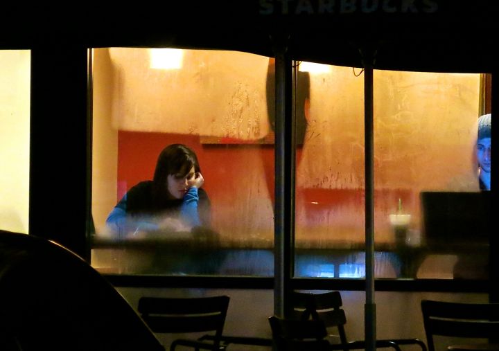 A young lady (and is the guy on the right creepy kind of creepy to any one else?) Starbucking at a partially fogged over window (thanks to winter finally making its way to Texas)….