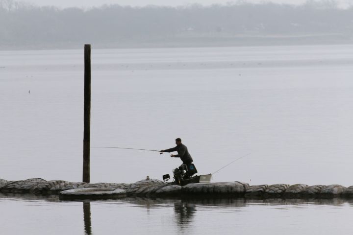 Reaching with his cast….