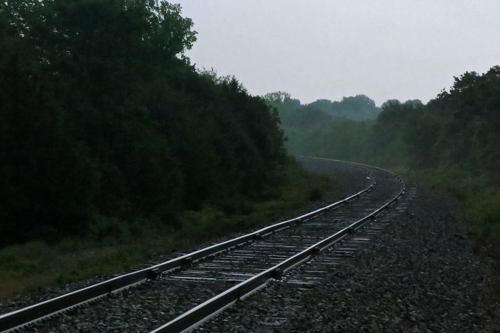 What is it about a lone pair of railroad tracks on an overcast morning that makes photographers photograph?