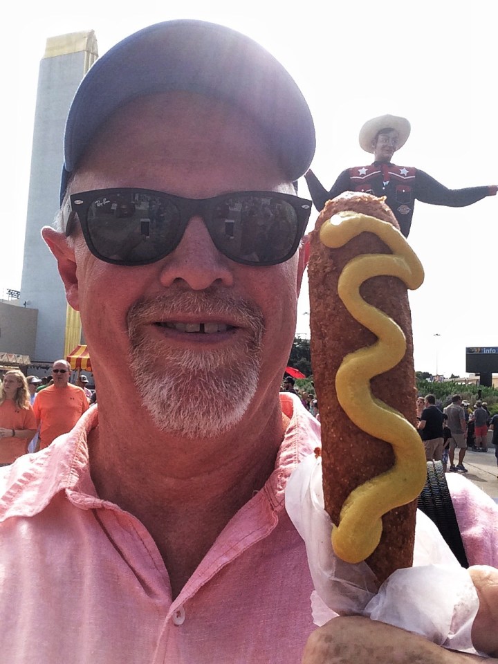 "OK Linc...if you don't do anything else today, you need to know about the world famous Fletcher's corny dog - and there is a style and showmanship to eating the thing...."